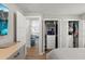 Spacious walk-in closet with ample storage, shelving, and a view of the living room beyond at 6286 Coniston St, Port Charlotte, FL 33981