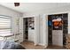 Bedroom closets equipped with shelving and storage solutions next to a study desk with natural light at 6286 Coniston St, Port Charlotte, FL 33981