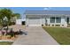 Home exterior with brick driveway, garage, and manicured landscaping at 6286 Coniston St, Port Charlotte, FL 33981