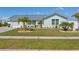 Beautifully landscaped front yard with a well-maintained lawn and charming curb appeal at 6286 Coniston St, Port Charlotte, FL 33981