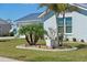 Lovely home with manicured lawn, palm trees, and beautiful landscaping at 6286 Coniston St, Port Charlotte, FL 33981