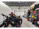 Organized garage space featuring ample storage shelves, utility sink, laundry area, and a secure area for bicycles and equipment at 6286 Coniston St, Port Charlotte, FL 33981