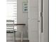 Cozy hallway nook with white chair, small table, and artwork offering a quiet, decorative space at 6286 Coniston St, Port Charlotte, FL 33981