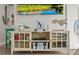 Tastefully decorated living room with decorative shelving showcasing unique accents and nautical decor at 6286 Coniston St, Port Charlotte, FL 33981