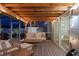 Inviting screened-in patio with comfortable seating, string lights, and a relaxing ambiance at 6286 Coniston St, Port Charlotte, FL 33981