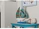 Charming side table features a decorative sailboat and sea-themed accents, enhancing the coastal style at 6286 Coniston St, Port Charlotte, FL 33981