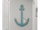 Charming wall decor features a large anchor, adding a nautical touch to the home's interior at 6286 Coniston St, Port Charlotte, FL 33981