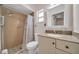 Cozy bathroom featuring a shower with a shower curtain and a vanity with granite countertops at 6841 46Th N St, Pinellas Park, FL 33781