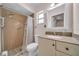 Cozy bathroom featuring a shower with a shower curtain and a vanity with granite countertops at 6841 46Th N St, Pinellas Park, FL 33781