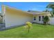 A single-story home with a well-maintained lawn at 6841 46Th N St, Pinellas Park, FL 33781