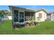 View of screened-in patio and yard at 6841 46Th N St, Pinellas Park, FL 33781