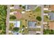Aerial view of the property showcasing a spacious yard and proximity to neighborhood amenities at 78 Zenith St, Port Charlotte, FL 33954
