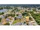 Stunning aerial view of the property and neighborhood featuring a lake in the distance at 78 Zenith St, Port Charlotte, FL 33954