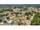 Beautiful aerial view showcasing single Gathering homes in a quiet residential neighborhood near a lake at 78 Zenith St, Port Charlotte, FL 33954