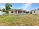 Large back yard with screened porch and utility shed at 78 Zenith St, Port Charlotte, FL 33954