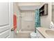 Bright bathroom showcasing a white vanity, toilet, and a clean bathtub-shower combo with colorful curtain at 78 Zenith St, Port Charlotte, FL 33954