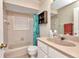 Cozy bathroom featuring a vanity with solid surface countertop, toilet, and tub-shower combination at 78 Zenith St, Port Charlotte, FL 33954
