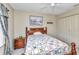Serene bedroom with ceiling fan, double door closet, and a cozy bed with a colorful quilt at 78 Zenith St, Port Charlotte, FL 33954