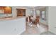 Bright kitchen with a cozy dining nook featuring a wooden table set and built-in hutch cabinet at 78 Zenith St, Port Charlotte, FL 33954