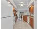Bright and airy kitchen with open floorplan, ceiling fan, and seamless connection to the breakfast nook at 78 Zenith St, Port Charlotte, FL 33954