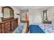 This bright main bedroom features attractive wood furniture and access to an adjoining bathroom at 78 Zenith St, Port Charlotte, FL 33954