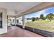 This screened porch features open views of the backyard and neighborhood beyond at 78 Zenith St, Port Charlotte, FL 33954