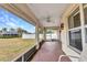 View of the backyard from this home's comfortable and airy screened porch at 78 Zenith St, Port Charlotte, FL 33954
