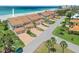 Beautiful beachfront condos with tile roofs and private garages offer stunning ocean views and lush landscaping at 876 Golden Beach Blvd # 876, Venice, FL 34285