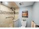 Updated bathroom with a glass-enclosed shower, modern fixtures, and tiled accents at 876 Golden Beach Blvd # 876, Venice, FL 34285