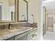 Elegant bathroom featuring granite countertops, decorative tile, and lots of storage space at 876 Golden Beach Blvd # 876, Venice, FL 34285