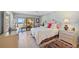 Inviting bedroom with balcony access features a comfortable bed and dresser with beautiful beach views at 876 Golden Beach Blvd # 876, Venice, FL 34285