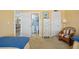 View of the guest bedroom and bathroom that contains coastal accents and decor at 876 Golden Beach Blvd # 876, Venice, FL 34285