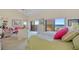 Spacious bedroom with vaulted ceilings, a view, and a comfortable seating area at 876 Golden Beach Blvd # 876, Venice, FL 34285