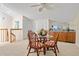 Cozy dining area with seating for four, wet bar, and natural light from the skylight at 876 Golden Beach Blvd # 876, Venice, FL 34285