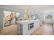Spacious kitchen with a large island featuring stainless steel appliances, and access to the living area at 876 Golden Beach Blvd # 876, Venice, FL 34285