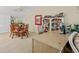 Bright office space with built-in bookcase, desk, and views of the dining area at 876 Golden Beach Blvd # 876, Venice, FL 34285