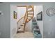 Unique spiral staircase featuring wood treads and railing, with a coastal-themed decor at 876 Golden Beach Blvd # 876, Venice, FL 34285