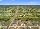 Expansive aerial view of a well-planned community near canals and roadways in Florida at 10517 Greenway Ave, Englewood, FL 34224