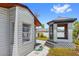 Gazebo with screening in a backyard with mature trees and gravel landscaping at 10517 Greenway Ave, Englewood, FL 34224