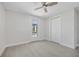 Clean bedroom with ceiling fan, closet and outdoor access creates a simple and functional space at 10517 Greenway Ave, Englewood, FL 34224
