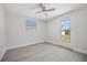 Light-filled bedroom features a door to the outside, offering an easy transition to the outdoors at 10517 Greenway Ave, Englewood, FL 34224