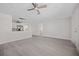 Open-concept living space flowing into a modern kitchen with stainless steel appliances at 10517 Greenway Ave, Englewood, FL 34224