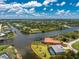 Idyllic waterfront home with a screened-in pool, spacious backyard, and canal access at 13284 Amaryllis Cir, Port Charlotte, FL 33981