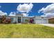 Well-manicured front yard showcases a stylish two-story home with a two-car garage at 13284 Amaryllis Cir, Port Charlotte, FL 33981