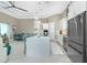 Bright, open kitchen with a large island, modern appliances, and adjacent dining area at 13284 Amaryllis Cir, Port Charlotte, FL 33981