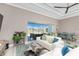 Cozy living room with stylish furnishings and a large sliding glass door offering access to the outdoor area at 13284 Amaryllis Cir, Port Charlotte, FL 33981