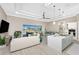 Open concept living area with a view of the screened lanai, showcasing modern decor and dining space at 13284 Amaryllis Cir, Port Charlotte, FL 33981