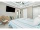 Serene main bedroom featuring a comfortable bed, stylish decor, and ample natural light at 13284 Amaryllis Cir, Port Charlotte, FL 33981