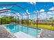 This in-ground pool is surrounded by a screened enclosure and boasts a luxurious jacuzzi at 13284 Amaryllis Cir, Port Charlotte, FL 33981