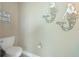 Coastal-themed powder room featuring mermaid decorations and a simple design at 13284 Amaryllis Cir, Port Charlotte, FL 33981